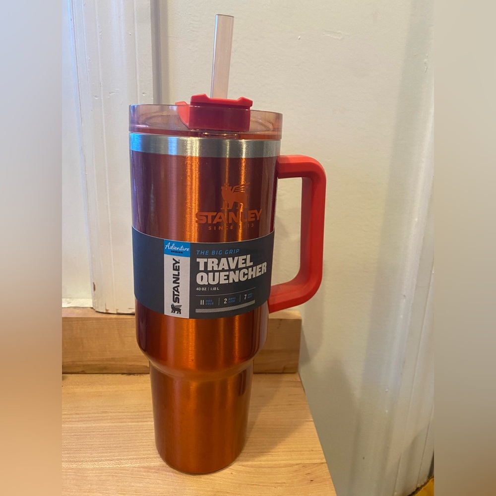Never used metallic Stanley tumbler. 40 ounces. Original, never used straw.